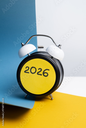 Photography Alarm clock with number 2026 on colorful blue and yellow background