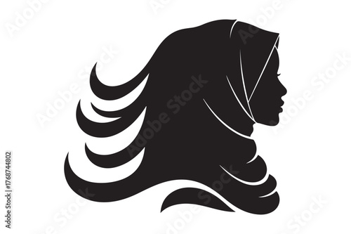Silhouette of a woman wearing a hijab with flowing hair