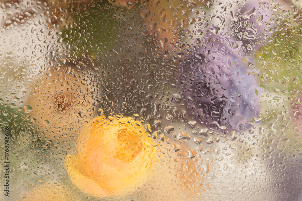 Fototapeta premium Smoke selected soft focus flower bouquet through glass with wet water drops. Abstract natural blur background.