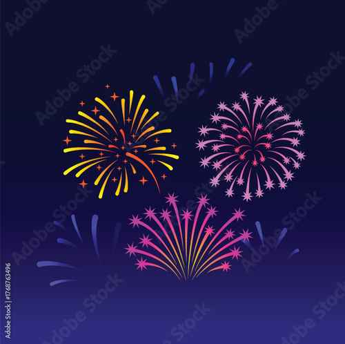 Colorful pyrotechnics explode across the night sky during a celebration festival event