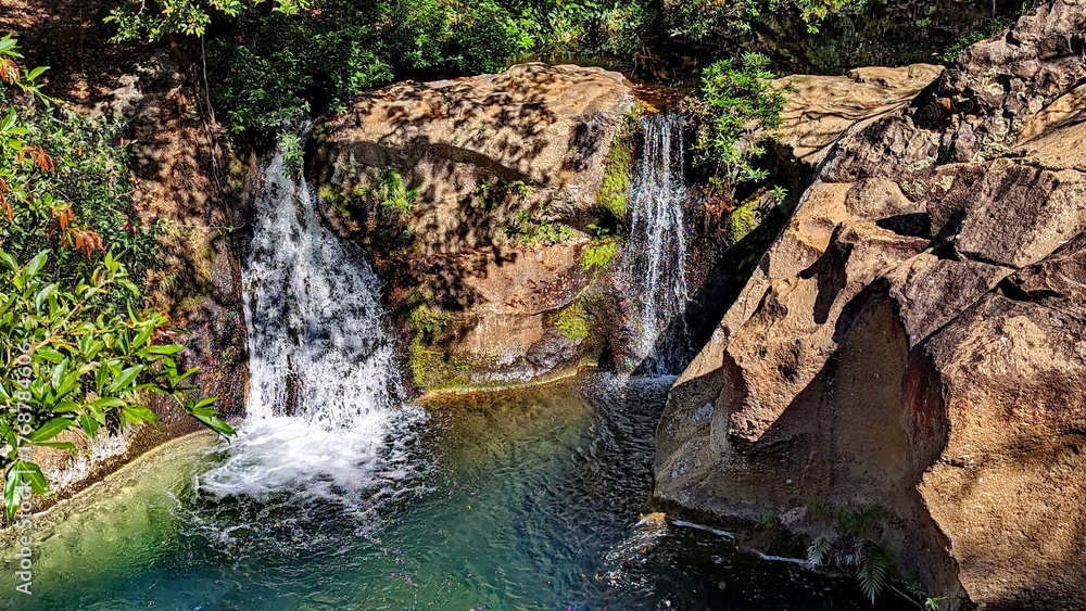 Obraz premium Twin Las Chorreras Waterfalls near Rincon National Park in Costa Rica. These falls, along with their pool at the bottom, are a popular place to swim.