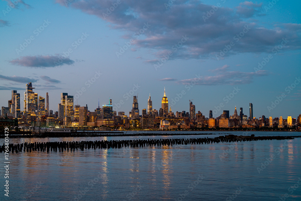 Fototapeta premium New York City. NYC cityscape with skyscrapers. Panoramic of New York City skyline. Manhattan skyline. New York and Hudson River. Downtown NYC. New York skyscrapers. The business district of NYC.