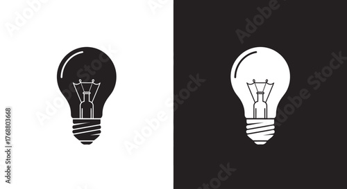 A simple graphic illustration of two light bulb icons, one black on a white background and its white inverse on a black background.