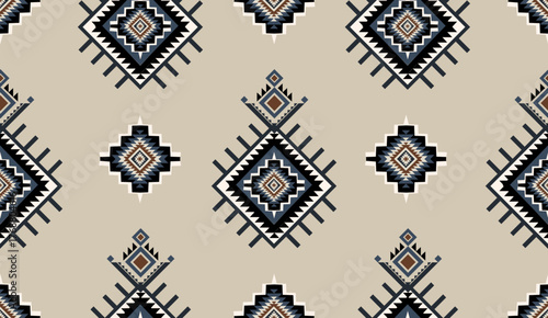 Seamless geometric ethnic pattern inspired by Native American tribal fabric. Traditional Aztec and Navajo style carpet and tile vector design on navy blue background. Perfect for textile, wrapping,