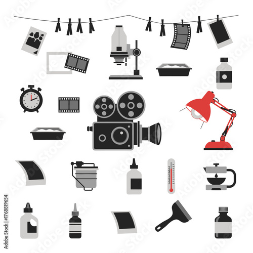 A collection of vintage photography and filmmaking equipment. Includes a camera, clock, and chemicals