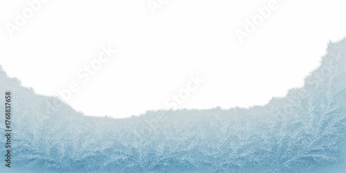 Blue sky and bright sun light up a white, cold winter mountain landscape covered in snow and ice