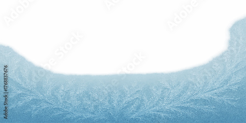 Winter nature landscape of snow-covered mountains and pine trees under a cold blue sky with white frost