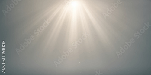 Bright sun rays shine through clouds over a brushed silver metal texture