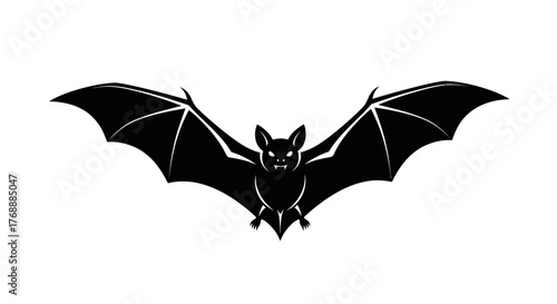 A black silhouette of a bat with its wings spread is isolated on a white surface.