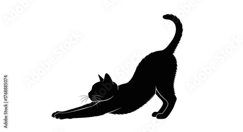 A black cat stretches its body in a graceful pose against a plain white surface, creating a.