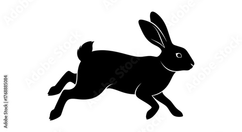 A black silhouette of a rabbit is leaping forward against a plain white surface, portraying.