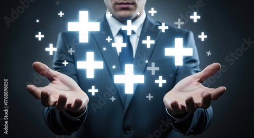 Professional businessman presenting glowing plus signs, symbolizing growth, benefits, and positive outcomes with open hands.