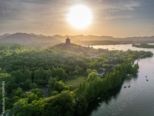 Aerial view of West Lake on left and Leifeng Tower from Wushan Hill at sunset, Xihu District, Hangzhou, Zhejiang, China. Tourist attraction.