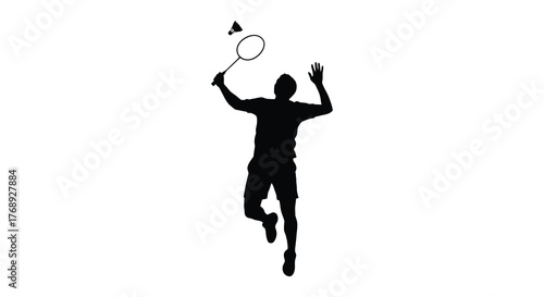 Dynamic silhouette of a badminton player in mid jump hitting a shuttlecock during a match