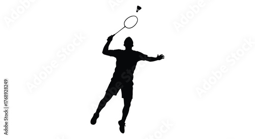 Dynamic silhouette of a male badminton player leaping to hit a shuttlecock during a powerful overhead smash silhouette