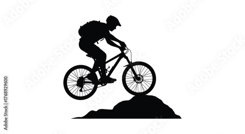 Dynamic silhouette of a mountain biker in mid air performing a jump over an obstacle on a white background