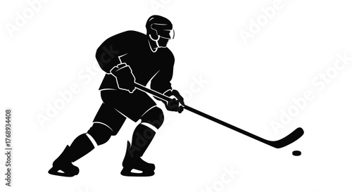 Dynamic hockey player in action striking a puck during a game silhouette