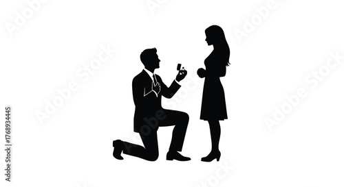 Man kneeling proposing marriage to woman holding engagement ring silhouette