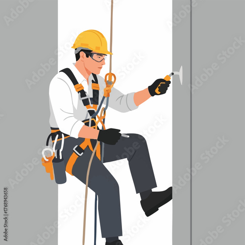 A construction worker wearing safety gear uses a drill while suspended by ropes, performing maintenance on a building's exterior wall.