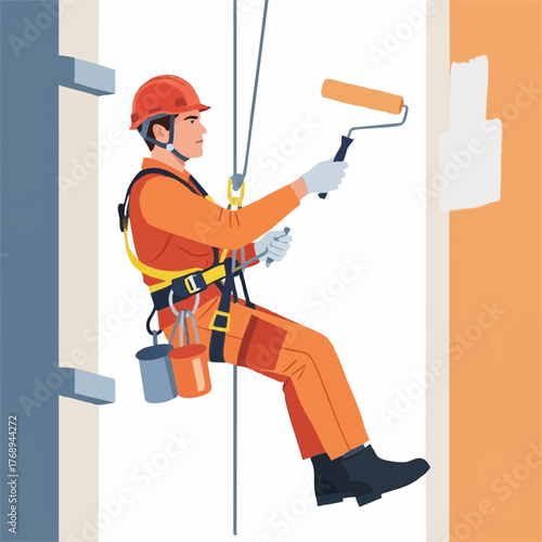 An industrial painter safely suspended by ropes uses a paint roller to apply white paint to a building's exterior wall for maintenance.