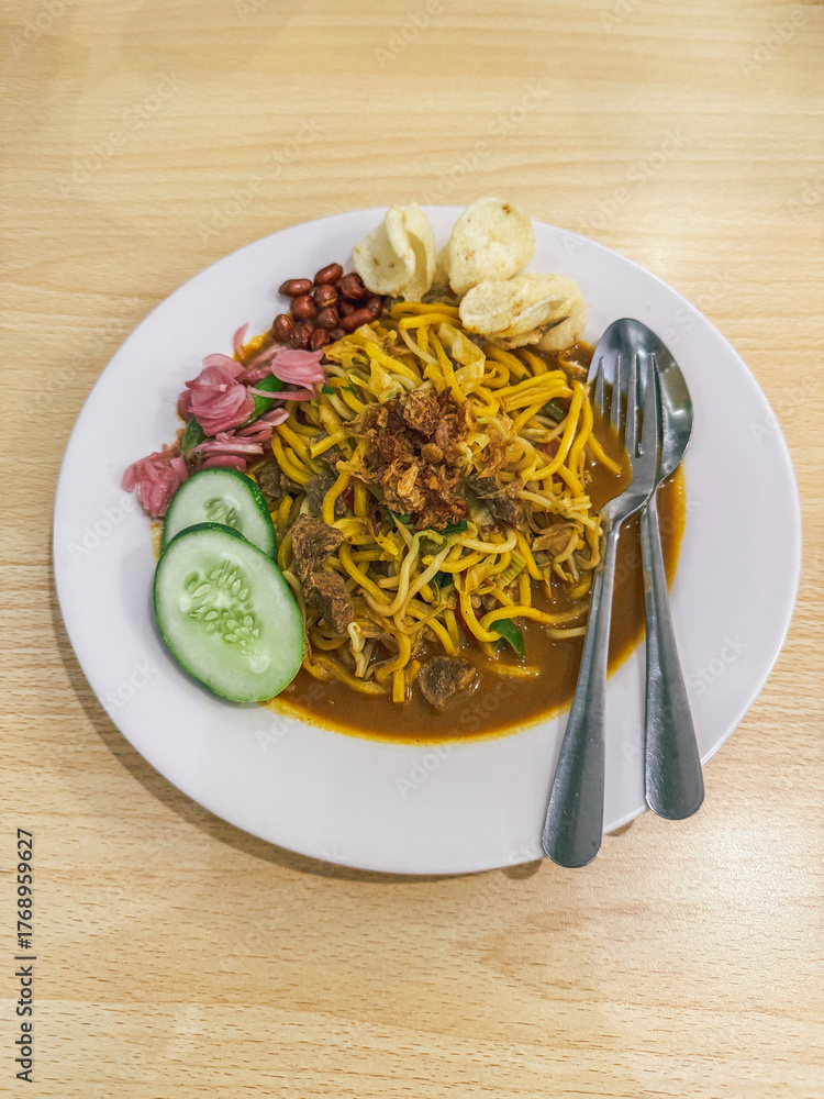 custom made wallpaper toronto digitalA plate of traditional Indonesian Mie Aceh served with rich spicy curry sauce, beef, cucumber slices, peanuts, crackers, and fried shallots on top.