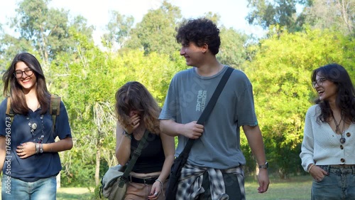 groupe of young people walking at park