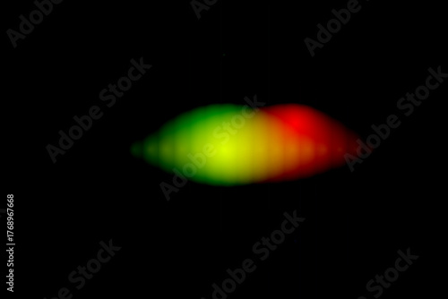 Minimalist Dark Abstract Background with Blurred Red and Green Glowing Light Shape