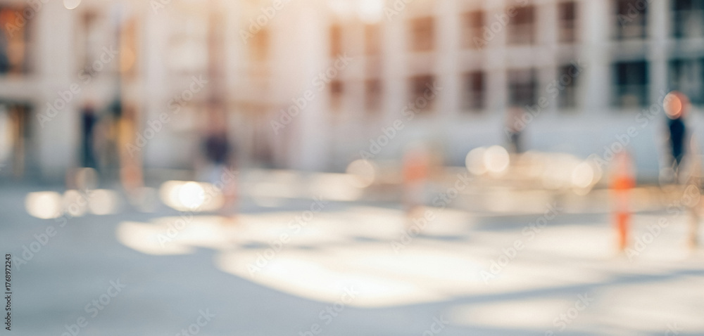 Obraz premium A softly blurred outdoor view with faint human figures surrounded by golden sunlight and bright bokeh circles, evoking warmth, distance, and a peaceful dreamlike atmosphere.