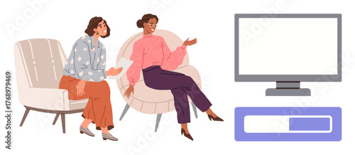 Two women in relaxed attire engage in conversation on modern chairs, a blank TV screen and progress bar nearby. Ideal for communication, teamwork, planning, relaxation, discussion, brainstorming