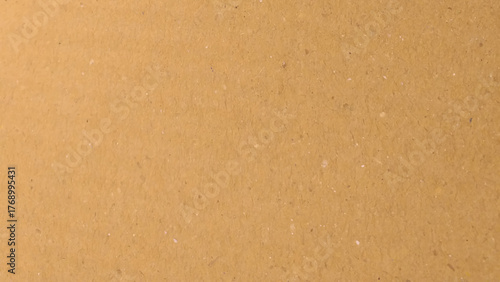 Brown paper texture background for presentation product. Pastel peach illumination, grainy color gradient background