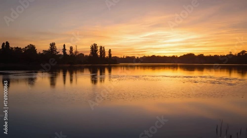 Serene Lake at Sunset with Golden Reflections and Trees