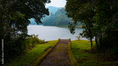 Palakkad, Kerala, India - October 2025: A serene view of the Siruvani Dam surrounded by lush green forest and mist-covered hills, showcasing the natural beauty of Palakkad.
