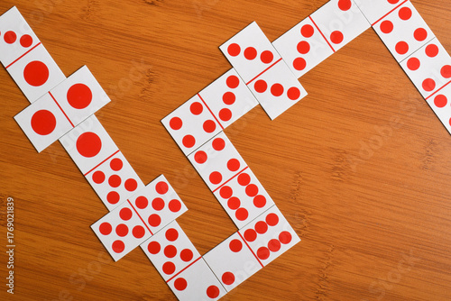 Domino card on wooden table background