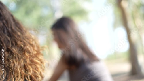 two young women riding bikes