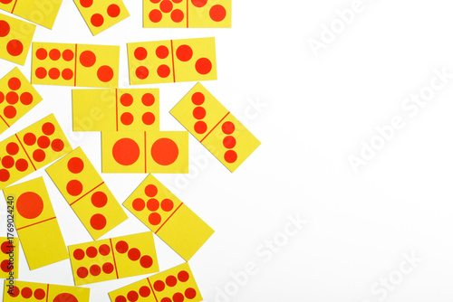 Domino pieces on white background with copy space