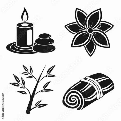 Spa still life with candle, stones, flower and towel