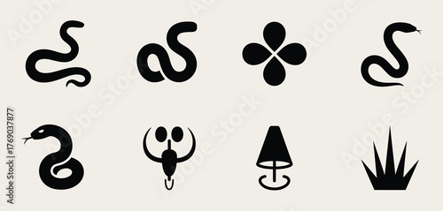 Collection of black tribal style snake and symbol silhouettes on beige background