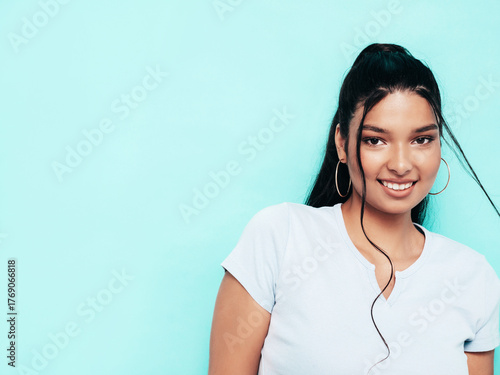 Fotografie Young beautiful smiling female in trendy summer  top clothes