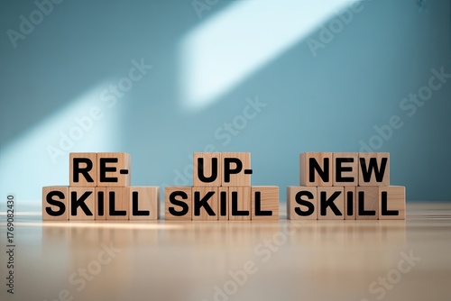 Wooden blocks spell out reskill upskill new skill symbolizing career change and professional development