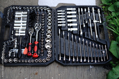 Complete set of tool accessories neatly organized in a black toolbox for home repairs and maintenance tasks