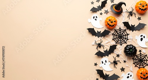 Festive halloween decorations including adorable ghosts bats and pumpkins scattered across a light beige background with copy space