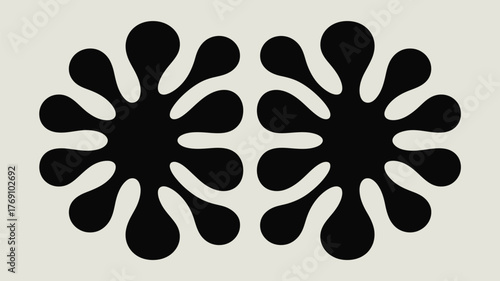 Two black inkblot shapes symmetrically arranged on a light gray background in a simple illustration