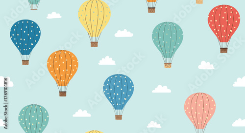 Whimsical hot air balloons float among fluffy clouds against a light blue sky, creating a cheerful pattern.