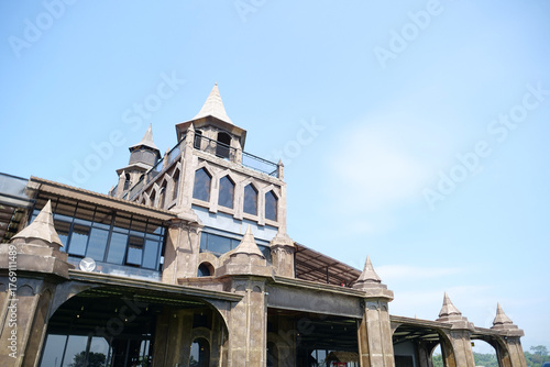 Modern Castle Building with Gothic-Inspired Architecture under Clear Blue Sky
