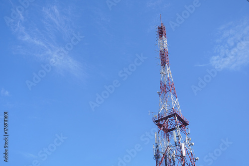 Tall Red White Telecommunication Tower Against Clear Blue Sky