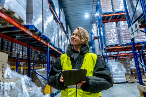 Canvas Print Woman checking inventory in cold storage warehouse