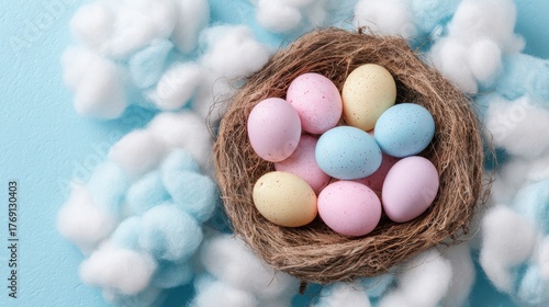 A nest filled with pastel Easter eggs sits among soft cotton clouds creating a charming spring scene.