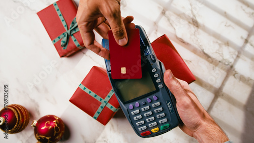 Electronic payment by card the POS for Christmas gift item during Black Friday