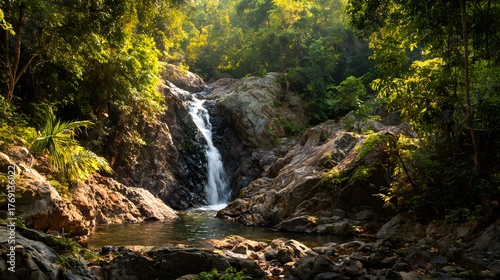 Jungle waterfall scene with sunlight filtering through trees and misty natural air