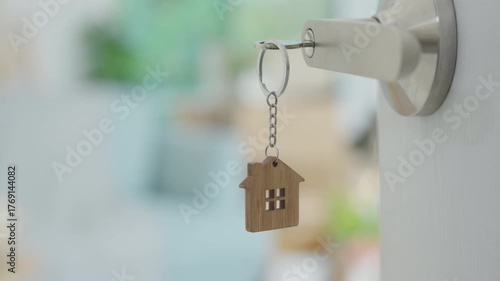The key was inserted into the door of the new house, inside the room was a cardboard box containing personal belongings and furniture. move in the apartment or condominium